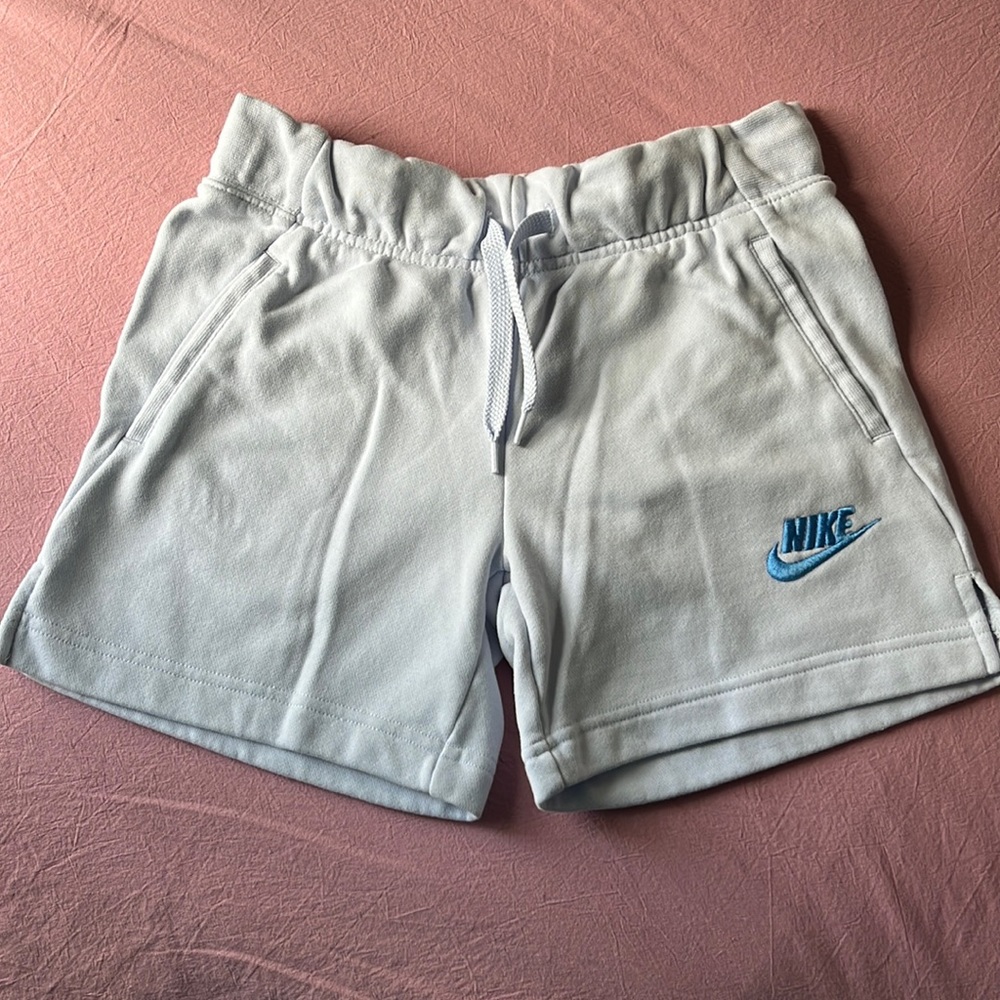 Light blue, Nike shorts.